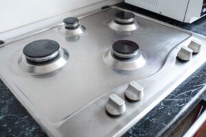 Polished gas cooker after washing.Perfectly clean gas cooker after being washed with polishing chemicals. The result of washing the burners.
